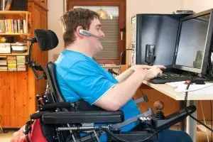 man with special needs using a desktop computer